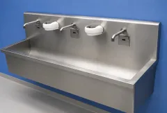 Sink_with_two_touchless_faucets_and_a_curved_bottom._1